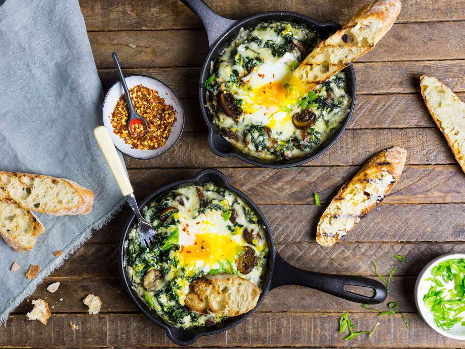 Baked Eggs With Creamy Greens, Mushrooms, and Cheese Recipe