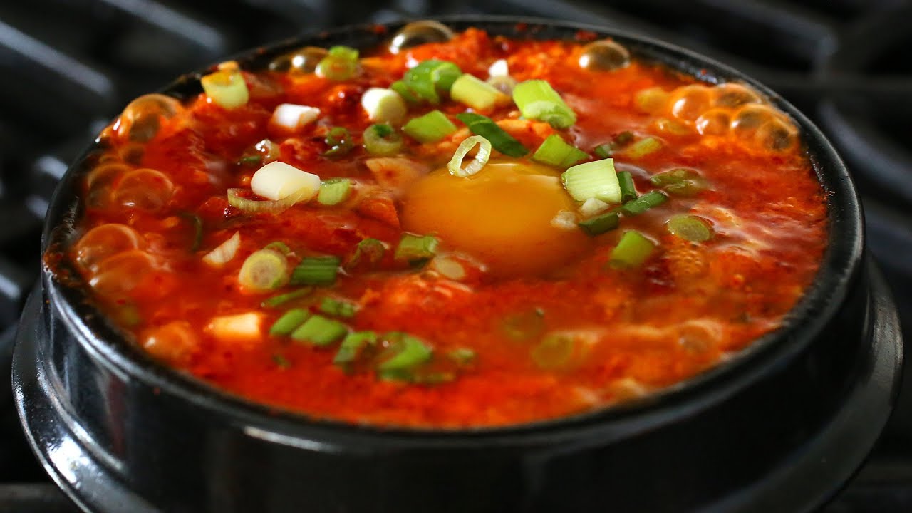 Kimchi sundubu-jjigae (김치순두부찌개) Spicy soft tofu stew with kimchi and pork belly recipe by Maangchi